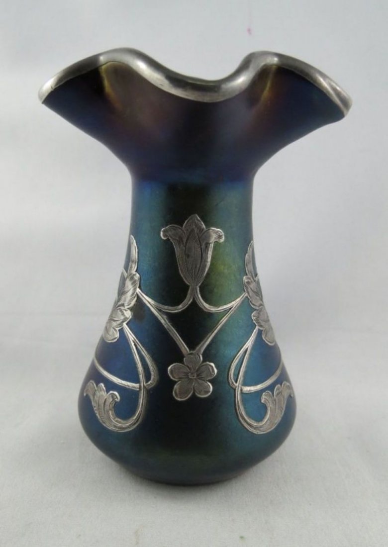 19th Century Loetz & Silver Overlay Vase with: 19th Century Loetz & Silver Overlay Vase with Iridescent Glass. Measures - 4 3/8" high x 3 1/8" wide.