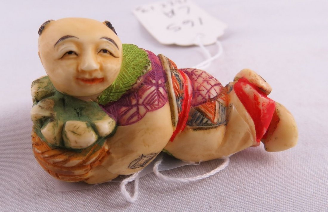 Polychrome Chinese Hand Carved Ivory Netsuke: Polychrome Chinese Hand Carved Ivory Netsuke. Measures- 2" long.