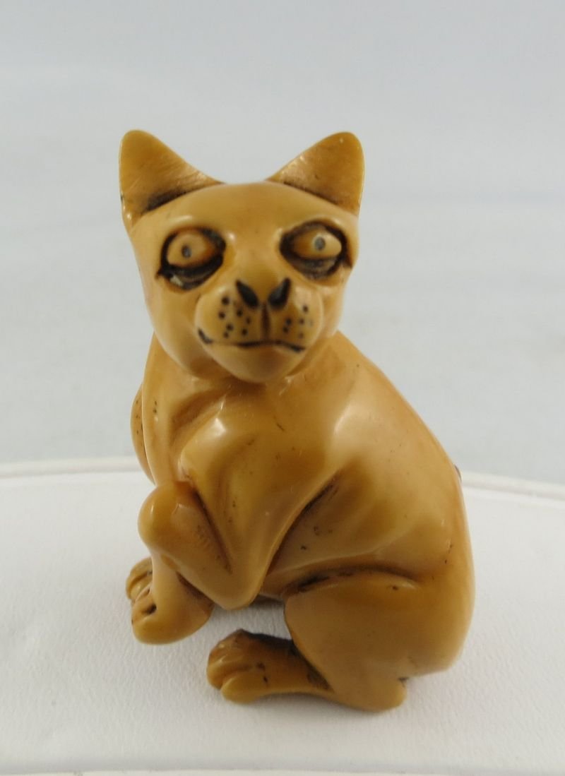 Antique Chinese Hand Carved Ivory Netsuke: Antique Chinese Hand Carved Ivory Netsuke, depicting dog with leg up. Measures - 2" high.