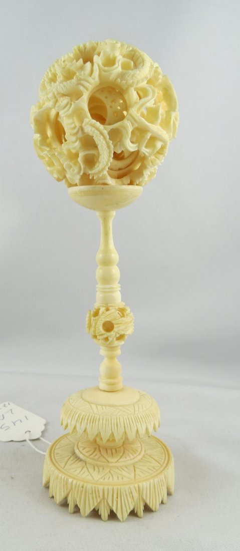 Chinese Hand Carved Ivory Puzzle Ball: Chinese Hand Carved Ivory Puzzle Ball. Measures - 7" high.