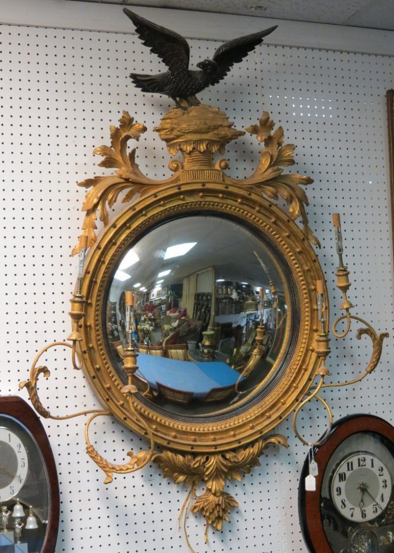 American Hand Carved Bulls-Eye Mirror: American Hand Carved Bulls-Eye Mirror. Measures - 55" high x 40" wide.