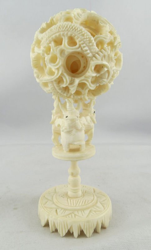 Chinese Hand Carved Ivory Puzzle Ball: Chinese Hand Carved Ivory Puzzle Ball. Measures - 5" high.