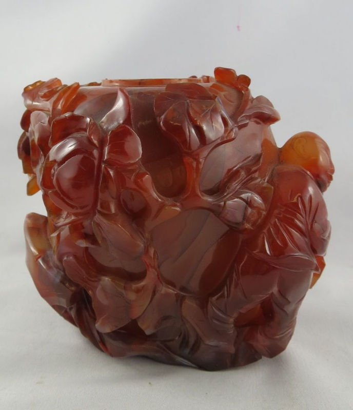 Antique Chinese Carved Carnelian Vase: Antique Chinese Carved Carnelian Vase, stunning floral design. Measures - 4 1/2" high x 5" wide.