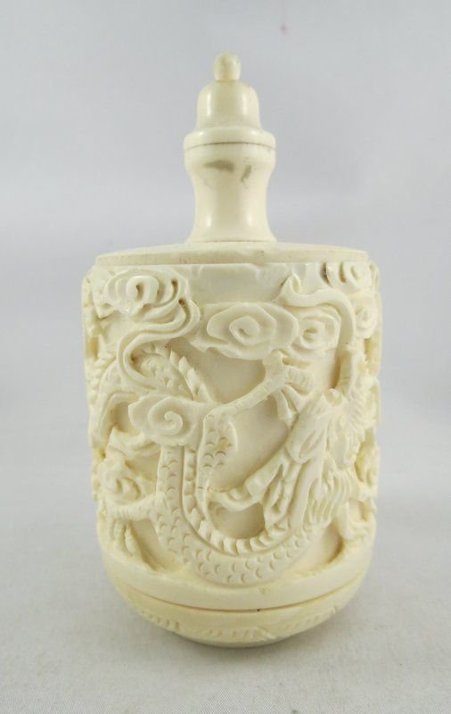 Antique Finely Carved Chinese Ivory Snuff Bottle: Antique Finely Carved Chinese Ivory Snuff Bottle, dragon design throughout. Measures - 4 1/8" high x 2 1/8" wide. Markers mark on bottom.