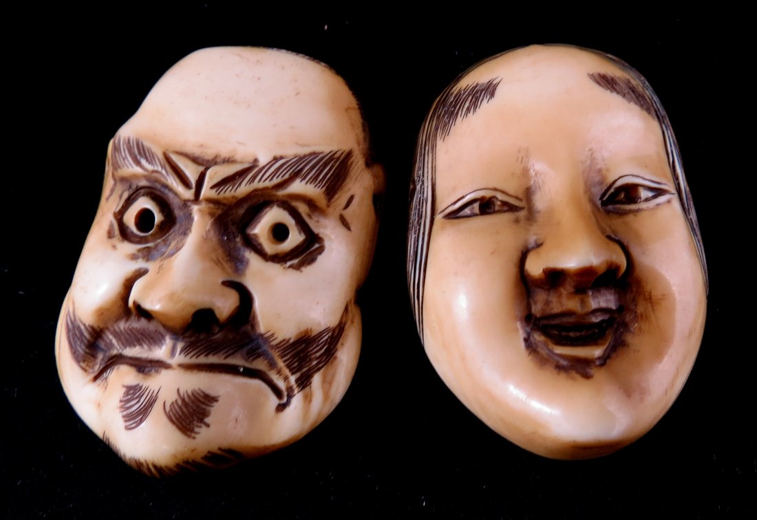2 Pc. Chinese Hand Carved Ivory Netsuke Masks: 2 Pc. Chinese Hand Carved Ivory Netsuke Masks. Measures - 1 1/4" long.