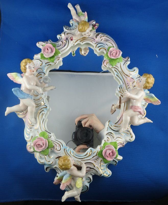 German Porcelain Hand Made Mirror: German Porcelain Hand Made Mirror. Measures - 15 1/2" high x 11" wide.