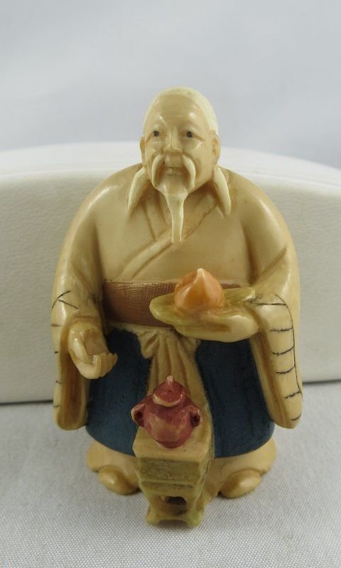 Chinese Hand Carved Netsuke: Chinese Hand Carved Netsuke. Depicting an old man with tea pot. Measures 2" high.