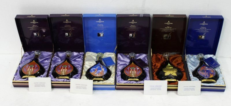 Collection of 6 Erte French Courvoisier Cognac: Collection of 6 Erte French Courvoisier Cognac. Each has original outer plastic and boxes. Box - 11" long x 8 1/4" wide, bottles - 9 3/4" high x 6 1/2" wide.