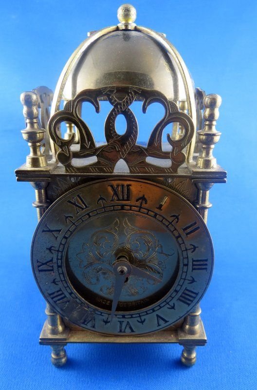 Great Britain Smith 8 Day Lantern Clock: Great Britain Smith 8 Day Lantern Clock, Roman Numeral face. Measures - 7 1/2" high x 3 1/2" wide.