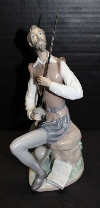 Lladro Spain Figure of Gentleman w/ Sword: Lladro Spain Figure of Gentleman w/ Sword. Measures - 8 3/4" high x 5" wide.