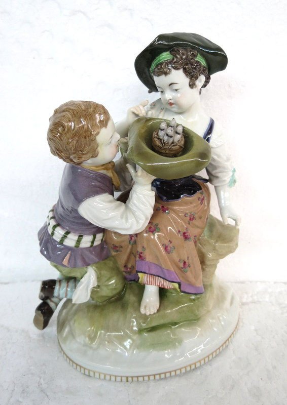 KPM Porcelain Group: KPM Porcelain Group of a couple. Bird nest in hat. Measures - 5 1/2" x 4 1/2". 140-324. Condition is mint.