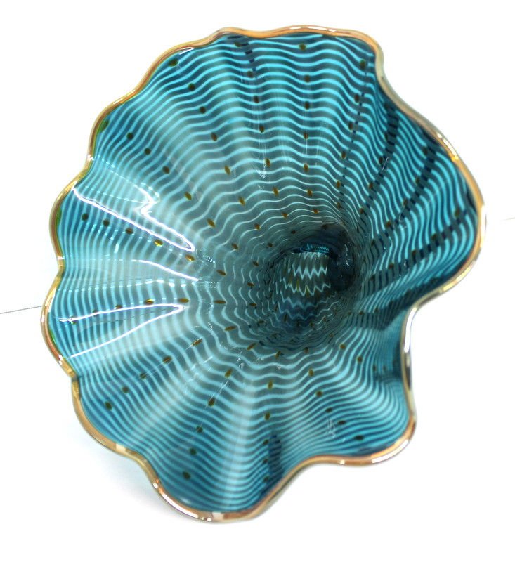 Gwen Knight Hand Blown Glass Sea Shell: Gwen Knight Hand Blown Glass Sea Shell with gold dots on a turquoise background. Measures - 9 1/2" high x 11" wide.