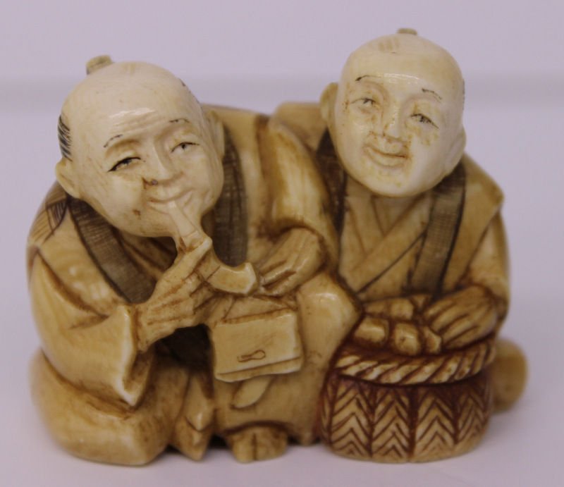 19th C. Japanese Carved Ivory Netsuke Group: 19th C. Japanese Carved Ivory Netsuke Group. 2 figures together. Measures - 1 1/2" high x 2" wide. Weighs - 52.4 grams.