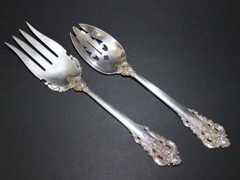 2 Pc. Wallace Grand Baroque Serving Pieces: 2 Pc. Wallace Grand Baroque Serving Pieces. Fork - 9 1/2" long, spoon - 9" long. Weighs - 7 troy oz.