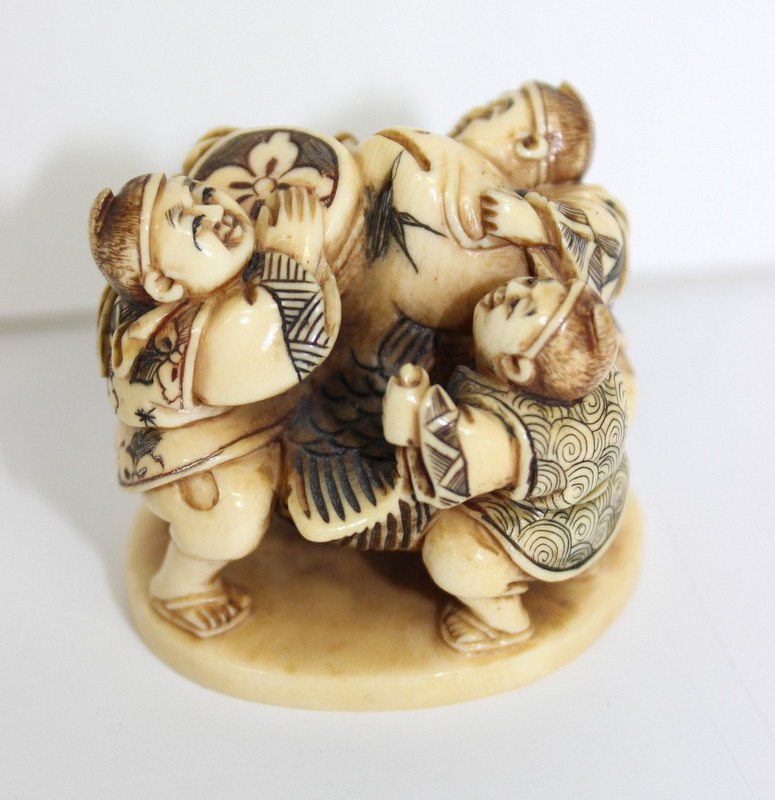 Japanese Finely Carved Ivory Netsuke Group: Japanese Finely Carved Ivory Netsuke Group. Measures - 1 1/2" high. Weighs - 35.5 grams.