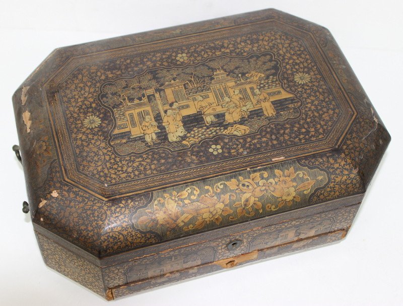 Chinese Export Lacquer Sewing Box: Chinese Export Lacquer Sewing Box. Chinese export lacquer sewing box, of octagonal form, depicting scrolling vine details with groups of buildings, interior drawer with various original carved ivory s