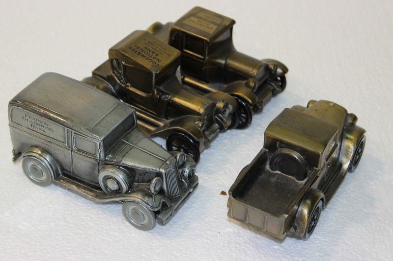 Set of 4 Antique Metal Toy Car Coin Banks: Set of 4 Antique Metal Toy Car Coin Banks. Varies - 6" long.