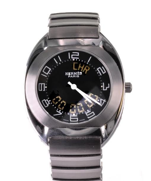Men's Steel Hermes Espace LED Wristwatch: Men's Steel Hermes Espace LED Wristwatch With Box and Papers. Featuring a three piece steel tonneau shaped case attached to a sectional steel Hermes band measuring 7 1/4 inches long, high grade Swiss