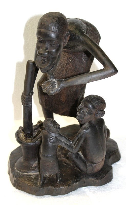 Carved African Tribal Figural Group: Carved African Tribal Figural Group. Measures - 18" high x 12" wide.