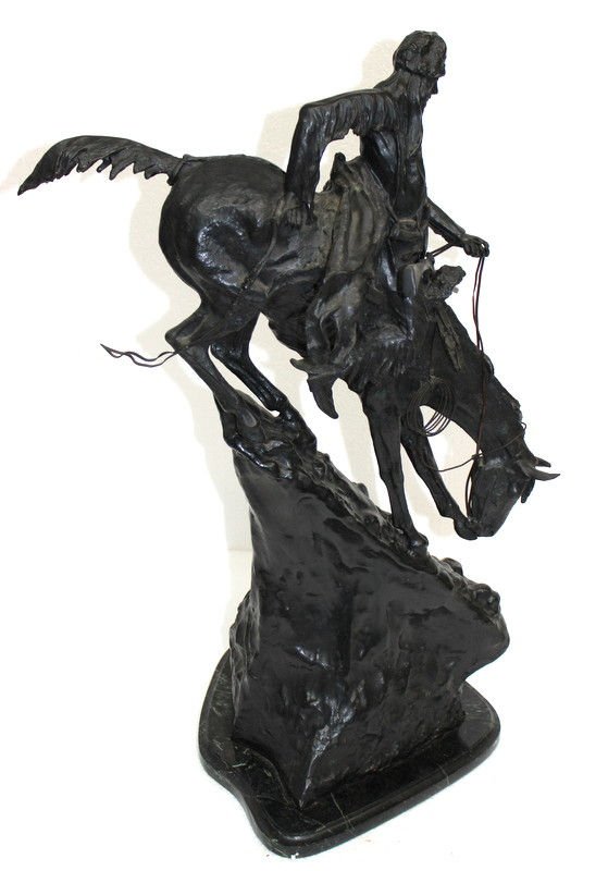 After Frederic Remington Mountain Man Bronze Sculpture: After Frederic Remington Mountain Man Bronze Sculpture. Signed sculpture of Indian on a horse walking down a mountain. Measures - 29 3/4" high x 22" long x 11" wide.