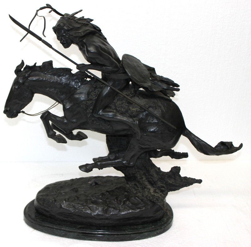 After Frederic Remington Cheyenne Bronze Sculpture: After Frederic Remington Cheyenne Bronze Sculpture. Signed sculpture of indian man riding on back of running horse. Measures - 22" high x 23 1/2" long x 9" wide.