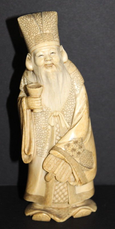 Carved Chinese Ivory Figure of Man w/ Cup: Carved Chinese Ivory Figure of Man w/ Cup. Measures - 6" high.