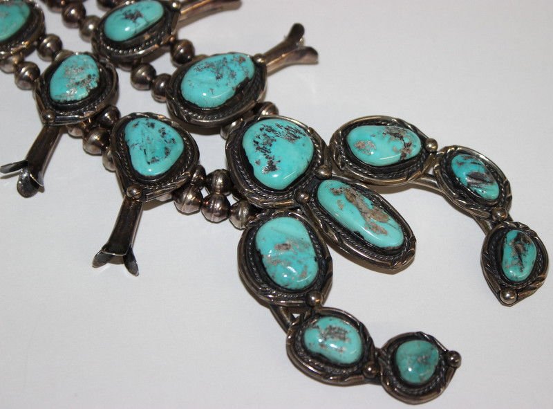 Sterling Silver Native American Squash Blossom Necklace: Sterling Silver Native American Squash Blossom Necklace. Measures - 28 1/4" long. Pendant - 3 3/4" high x 3 1/4" wide. Weighs approx. - 7.95 troy oz.