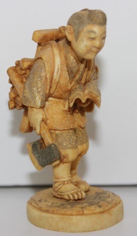 Fine Japanese Carved Ivory Netsuke: Fine Japanese Carved Ivory Netsuke. Finely carved wood carrier. Signed on bottom. Measures - 2 3/8" high, weighs - 21.3 grams.