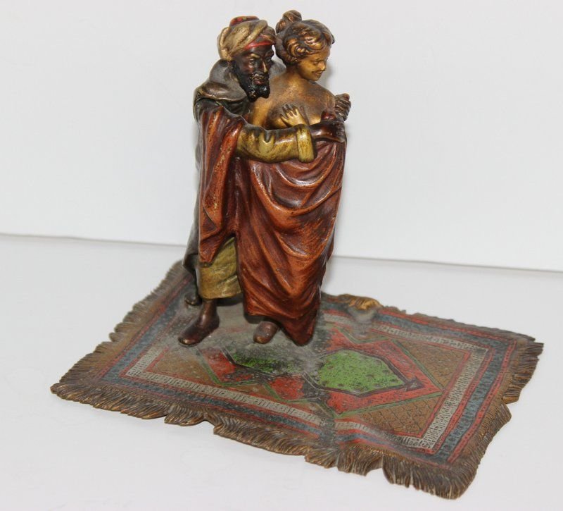 Franz Bergman (1861-1936) Bronze Slave Trader: Franz Bergman (1861-1936) Bronze Slave Trader. This colorful contemplative features a man holding a woman with an opening that reveals the woman as nude. Signed on bronze and foundry mark on bottom of