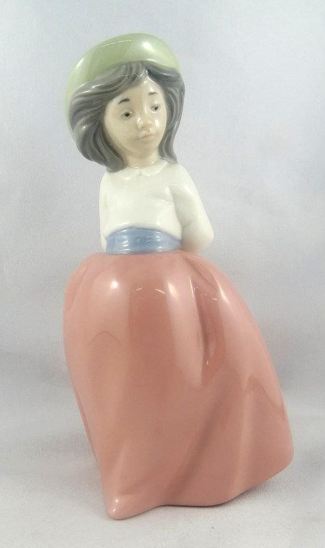 Nao by Lladro 'Little Girl on Placid Walk' #1291: Nao by Lladro 'Little Girl on Placid Walk' #1291 Porcelain Figure. Sculpted by - Jose Puche (1997). Retired - 2004. Measures - 6.5" high.