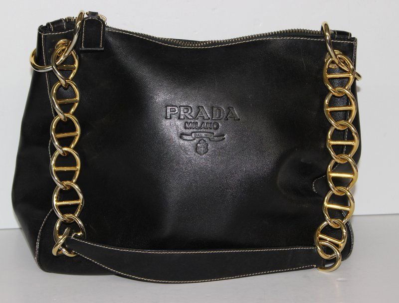 Prada Black Italian Leather Purse: Prada Black Italian Leather Purse with gold tone link chain strap. Measures - 13" x 10".