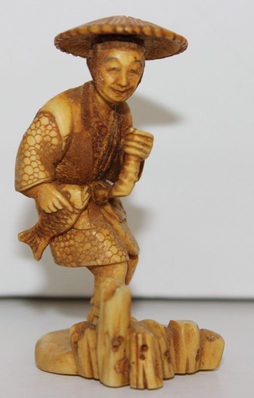 19th C. Japanese Carved Ivory Netsuke: 19th C. Japanese Carved Ivory Netsuke. Finely carved fisherman. Measures - 2 1/2" high. Weighs - 19.7 grams.