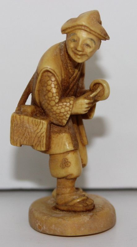 19th C. Japanese Carved Ivory Netsuke: 19th C. Japanese Carved Ivory Netsuke. Finely carved and stained man. Signed on bottom. Measures - 2 3/8" high. Weighs - 16.8 grams.