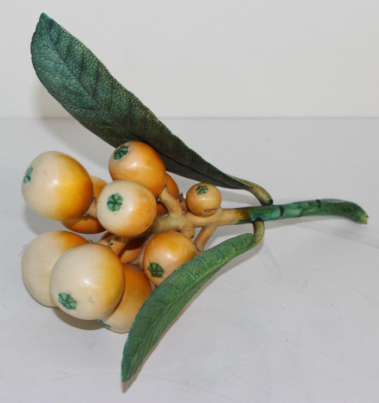 19th C. Chinese Finely Carved Ivory Polychrome Fruit: 19th C. Chinese Finely Carved Ivory Polychrome Fruit Branch. See photos for signature. Weighs - 553.7 grams. Weighs - 10" high x 8" wide.