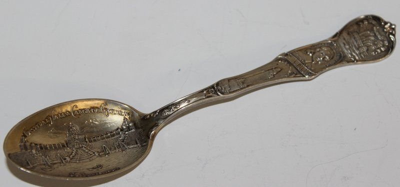 Sterling Silver Souvenir Spoon: Sterling Silver Souvenir Spoon featuring St. Louis, the city seal with steam boat and festival hall and cascade garden. St. Louis 1904. Weighs - 0.70 troy oz. Measures - 5 1/2" long.