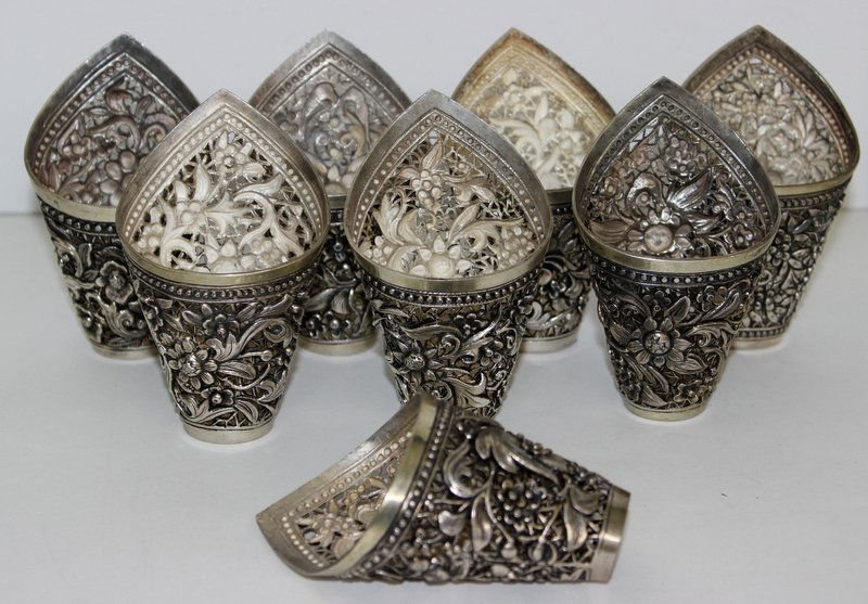 8 Pc. Oriental Art Nouveau Silver Napkin Rings: 8 Pc. Oriental Art Nouveau Silver Napkin Rings, floral design throughout. Measures - 3 3/4" high. Weighs - 12.18 troy oz.