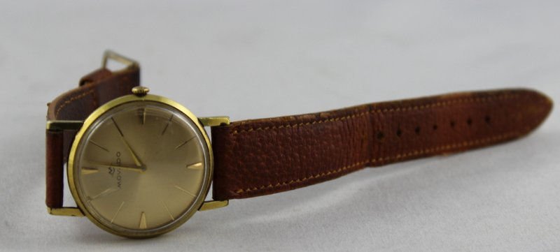 14Kt YG Movado Leather Watch: 14Kt YG Movado Leather Watch. Measures - 9 1/4" long.