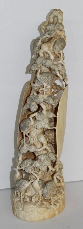Chinese Carved Ivory Tusk: Chinese Carved Ivory Tusk featuring birds throughout, with branches surrounding the whole tusk. Measures - 13 1/2" high x 4" diameter. Weighs - 1,054 grams. Please Contact - Tom at the UPS Store (561-