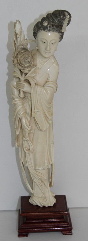 Chinese Finely Carved Ivory Quan Yen: Chinese Finely Carved Ivory Quan Yen. Ivory - 12" high. Total - 14" high. Quan Yen holding a floral arrangement. Please Contact - Tom at the UPS Store (561-739-9180) (tupss2807@gmail.com) for shipment