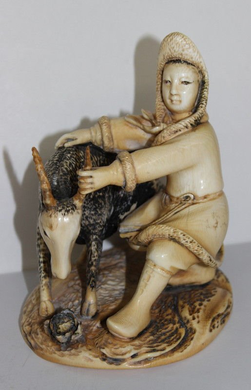 Chinese Finely Carved Ivory Group: Chinese Finely Carved Ivory Group, man holding onto a goats horn. Measures - 5" high x 4 1/2" diameter. Weighs - 441 grams. Please Contact - Tom at the UPS Store (561-739-9180) (tupss2807@gmail.com) f