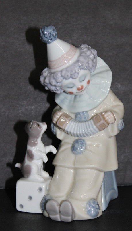 Lladro 'Pierrot Clown w/ Puppy' #5277 Porcelain Figure: Lladro 'Pierrot Clown w/ Puppy' #5277 Porcelain Figure. Issued - 1985, retired - 2007, sculptor - Jose Puche. Measures - 6" x 3" x 3.5".