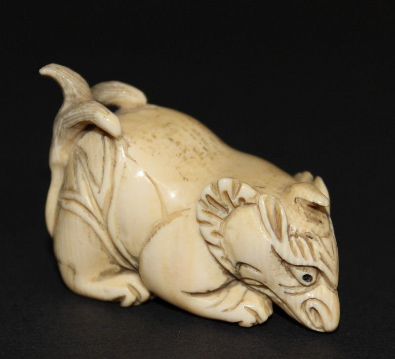Japanese Carved Ivory Netsuke of a Mythological Animal: Japanese Carved Ivory Netsuke of a Mythological Animal. Weighs - 23.1 grams. Please Contact - Tom at the UPS Store (561-739-9180) (tupss2807@gmail.com) for shipment of ivory. NO INTERNATIONAL SHIPPING