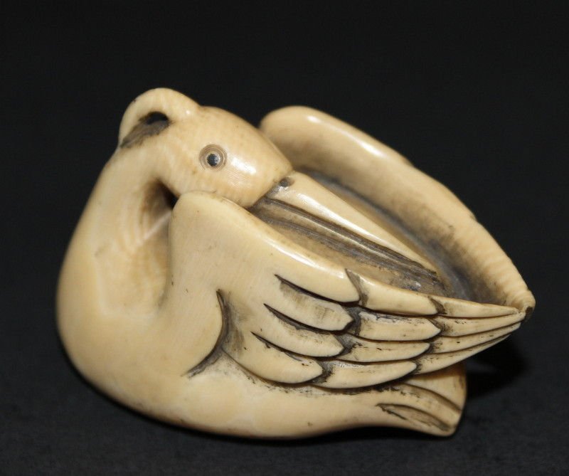 Carved Ivory Netsuke of a Bird, Signed: Carved Ivory Netsuke of a Bird, Signed. Weighs- 28.9 grams. Please Contact - Tom at the UPS Store (561-739-9180) (tupss2807@gmail.com) for shipment of ivory. NO INTERNATIONAL SHIPPING OF IVORY.