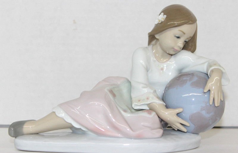 Lladro "World of Fantasy" Girl w/ Globe: Lladro "World of Fantasy" Girl w/ Globe. Made in Spain. Measures - 8" long x 5 1/2" high.