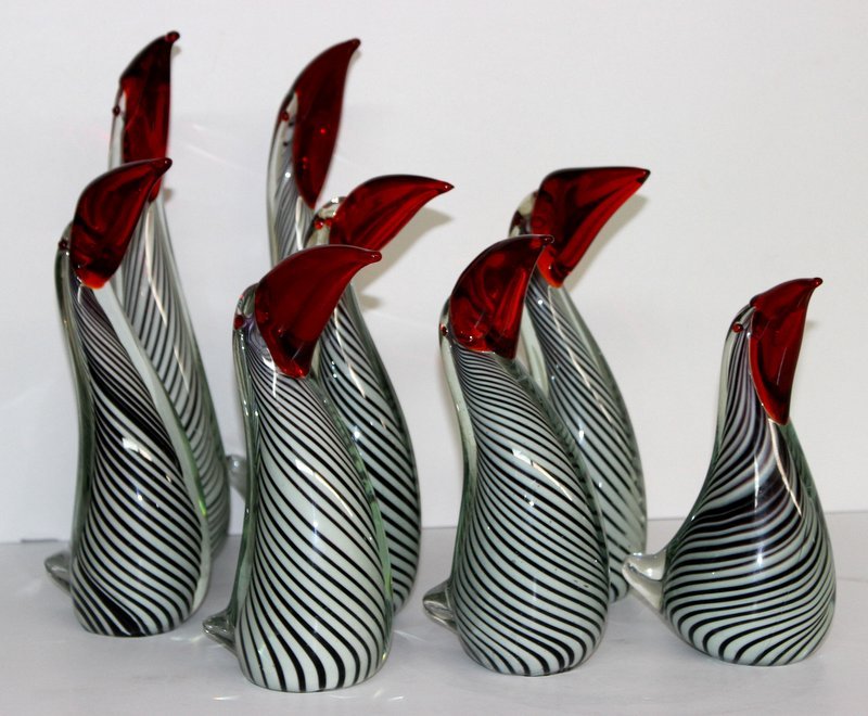 8 Pc. Murano Art Glass Family of Penguins: 8 Pc. Murano Art Glass Family of Penguins. Measures vary between - 7 3/4" - 12 1/4" high. Depicting family of red, white, black and clear glass penguins.