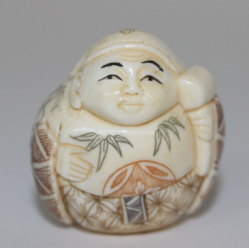 Carved Polychrome Signed Ivory Netsuke: Carved Polychrome Signed Ivory Netsuke. Weighs - 19.8 grams. Measures - 1 1/4" high.