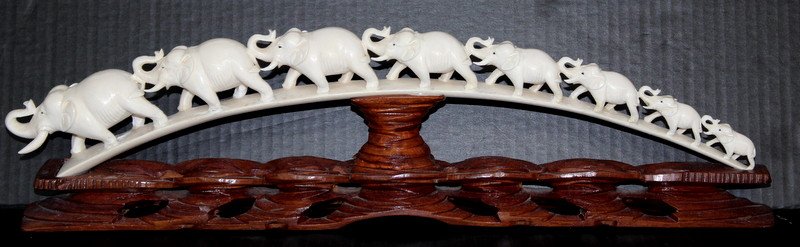 Extremely Fine Carved African Ivory Tusk: Extremely Fine Carved African Ivory Tusk. Featuring elephants on a bridge. Weighs - 1309.5 grams with base. Measures - 6" high x 21 1/2" long.
