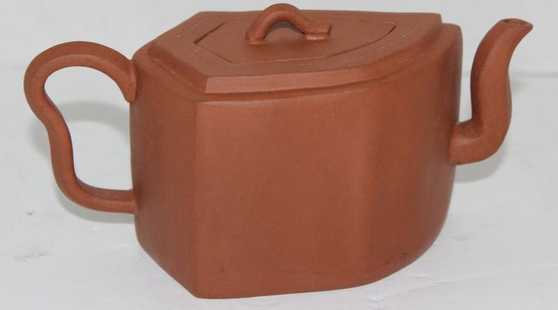 ANTIQUE CHINESE YIXING CLAY LEAF SHAPED TEAPOT: ANTIQUE CHINESE YIXING CLAY LEAF SHAPED TEAPOT. MEASURES AT 3"H X 7"L.