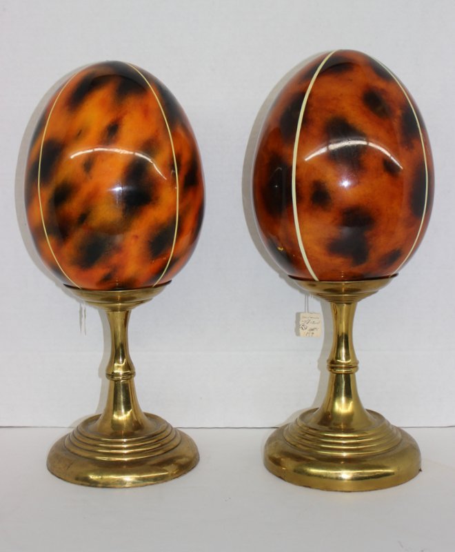PAIR OF MAITLAND SMITH TORTOISE SHELL STYLE EGGS: PAIR OF MAITLAND SMITH TORTOISE SHELL STYLE EGG, SITTING ON METAL BASES. MEASURES EGG 9 1/2 - BASE 9 1/2 h