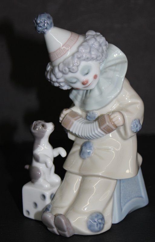 Lladro 'Pierrot w/ Concertina' #5279 Porcelain Group: Lladro 'Pierrot w/ Concertina' #5279 Porcelain Group. Measures - 6" high, issued - 1985, sculptor - Jose Puche.
